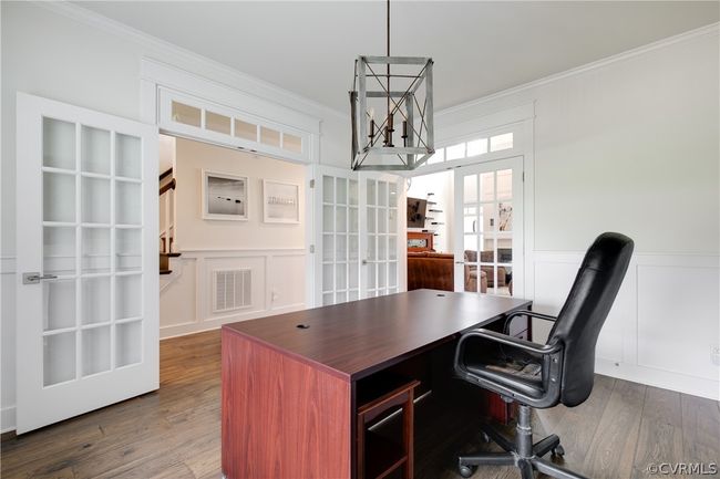 Home office featuring ornamental molding, dark hardwood / wood-style floors, and french doors | Image 21