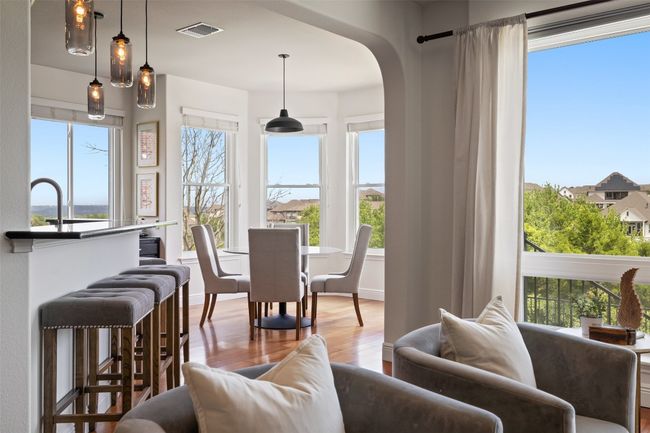Sunroom featuring healthy amount of natural light and arched walkways | Image 14
