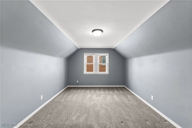 Bonus room with baseboards, carpet flooring, and vaulted ceiling | Image 25