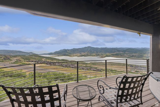 Balcony with a water and mountain view | Image 56