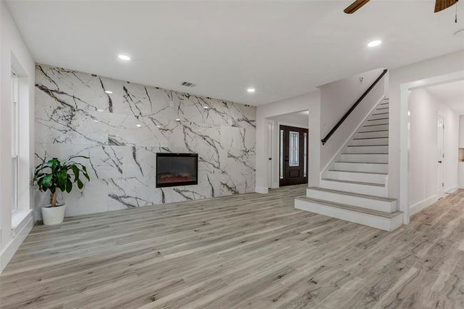 Spacious living room with a lovely electric fireplace for a few freezing days in the winter! | Image 8