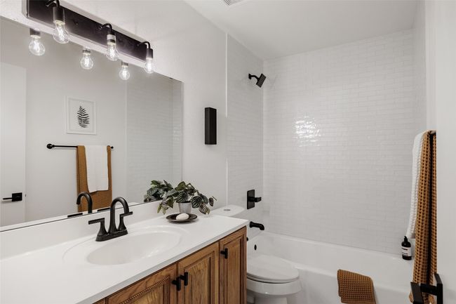 Full bathroom featuring vanity and bathing tub / shower combination | Image 27