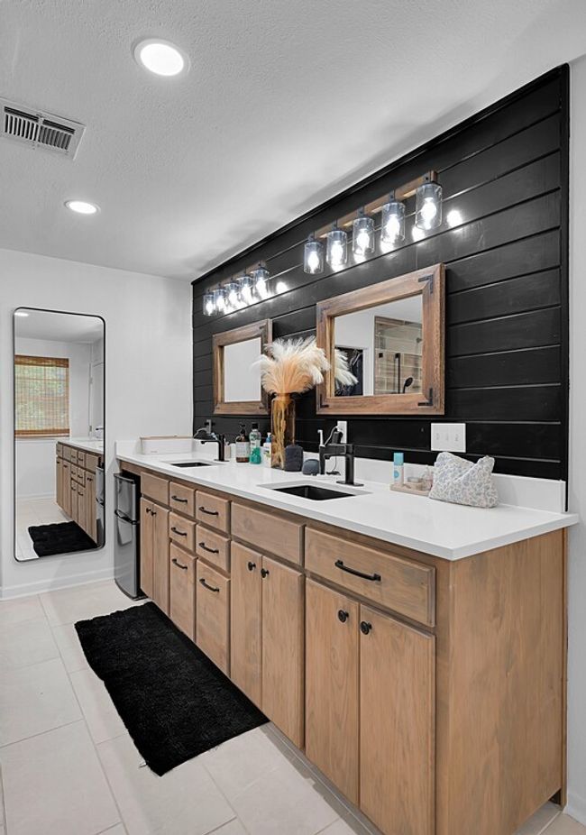 Bathroom featuring double vanity, a textured ceiling, tile patterned flooring, and recessed lighting | Image 18