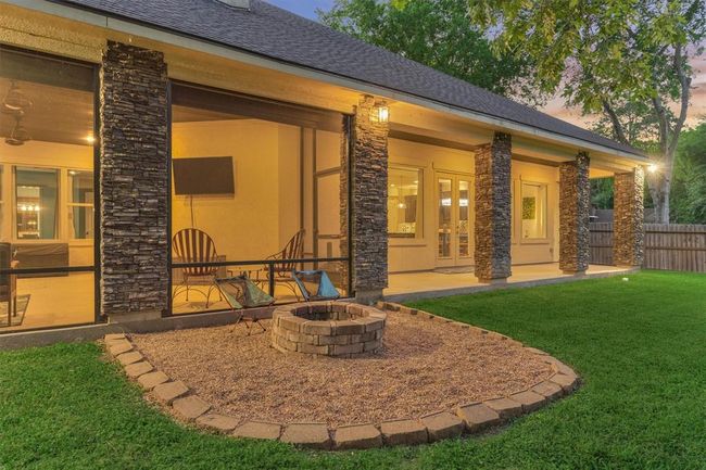 The cozy fire pit area offers the perfect spot to unwind on cooler evenings. | Image 40