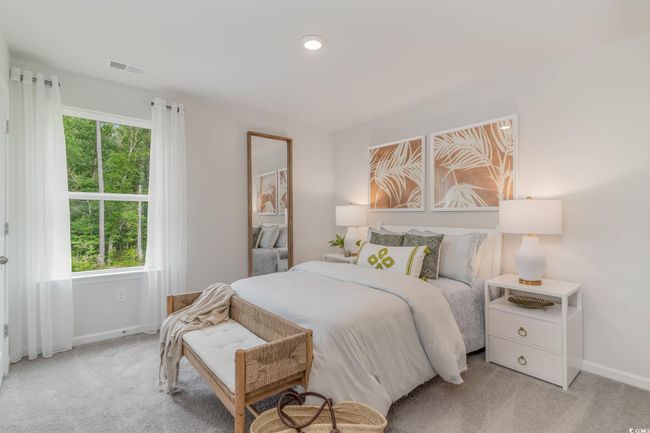Bedroom featuring baseboards, multiple windows, and light carpet | Image 25
