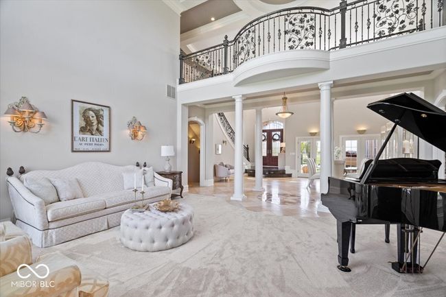 Seamlessly connected, the open and airy living and dining rooms are the perfect setting for entertaining and comfort. | Image 12