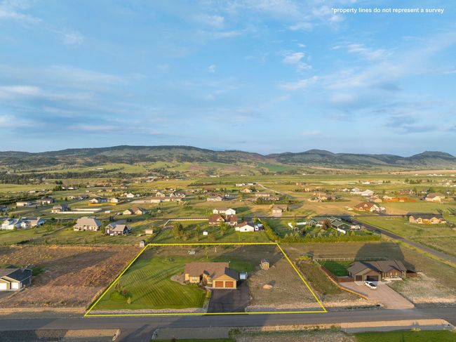Aerial perspective of suburban area featuring a mountain backdrop and property boundaries highlighted | Image 32