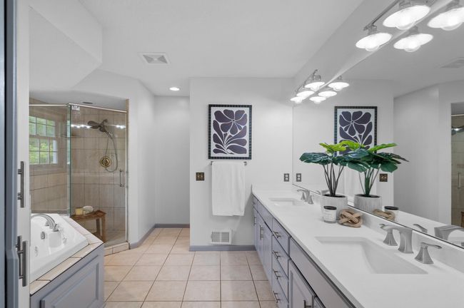 Pamper yourself in this spacious, elegant primary en suite. | Image 24