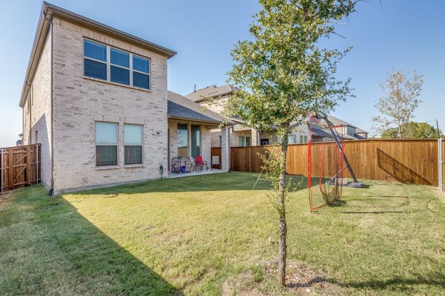 Back of house with brick siding and a patio | Image 22