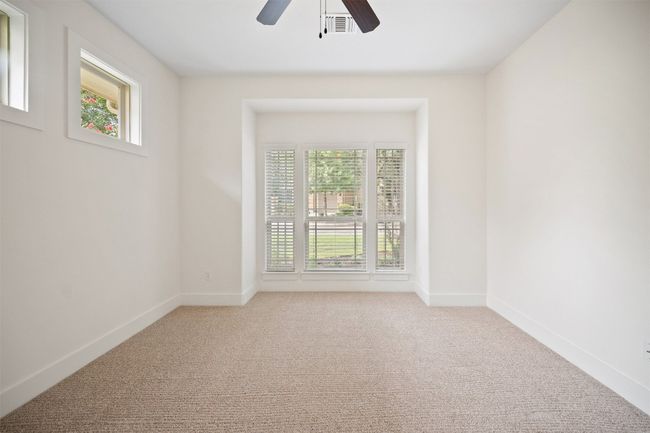 Windows along the back wall frame the greenbelt views that make it feel like your very own peaceful retreat | Image 20
