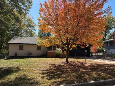 View of front of home with a garage and a front lawn | Image 3