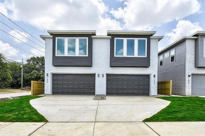 View of front of property featuring a garage | Image 1