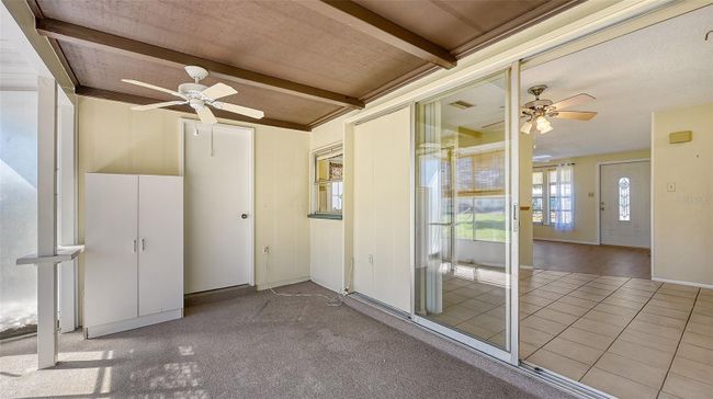 Enclosed Florida room with Laundry room off the side. | Image 20