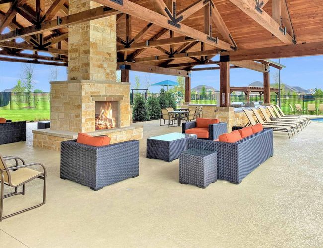 View of community patio featuring a gazebo and an outdoor living space with a fireplace | Image 21