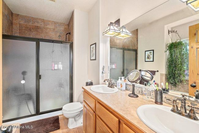 Master bathroom with dual sink vanity and tiled shower | Image 20