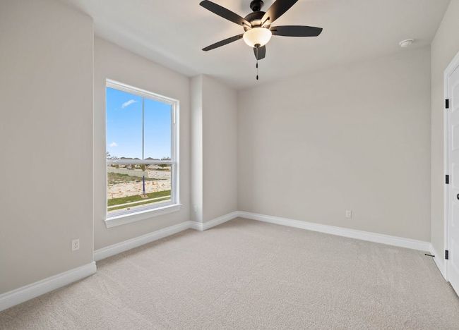 Spare room with a wealth of natural light, a ceiling fan, and light carpet | Image 25