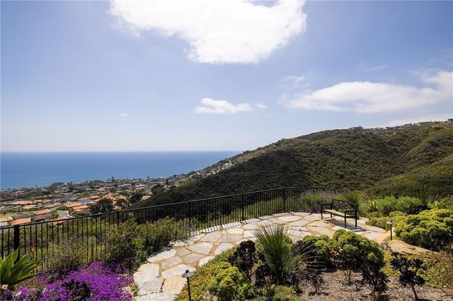 Thoughtfully designed gardens and reflection space are located on the lower part of your large 15, 656 sq ft lot. | Image 7