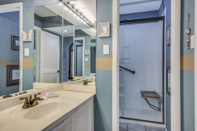 An ensuite bathroom completes the primary retreat with a large walk-in shower. | Image 8