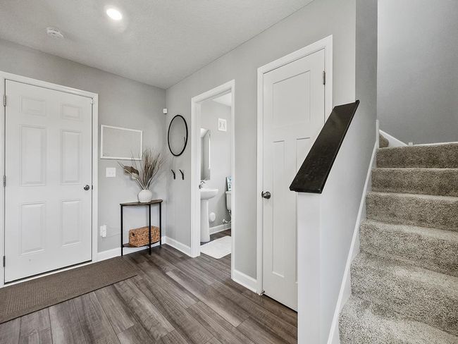 The ½ bathroom with LVP flooring adds convenience to the main level! | Image 13
