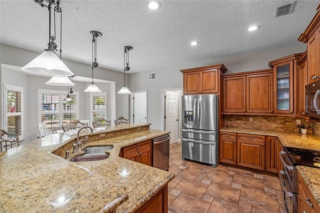 Kitchen/Breakfast Nook/Entry Way to1st Level 1/2 Bathroom and Laundry Room | Image 13