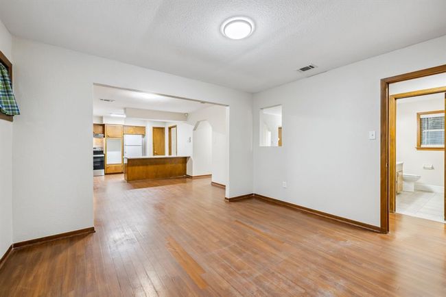 Bedroom #3 or Formal Dining Room while standing at window view into breakfast area, hallway and close to the secondary full bath. | Image 8