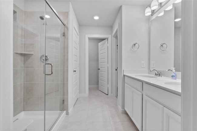 Primary bathroom with double sink and standing shower | Image 14