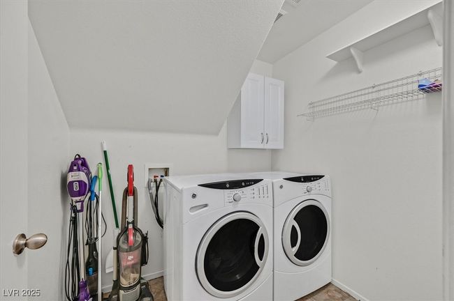 Laundry room with separate washer and dryer, cabinet space, and baseboards | Image 23