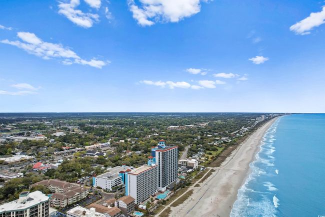 View of urban area with expansive beach | Image 39