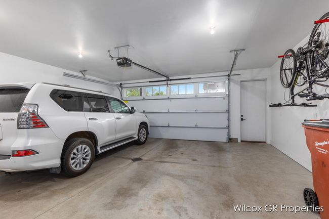 Spacious 2 car attached garage with private service door. | Image 37
