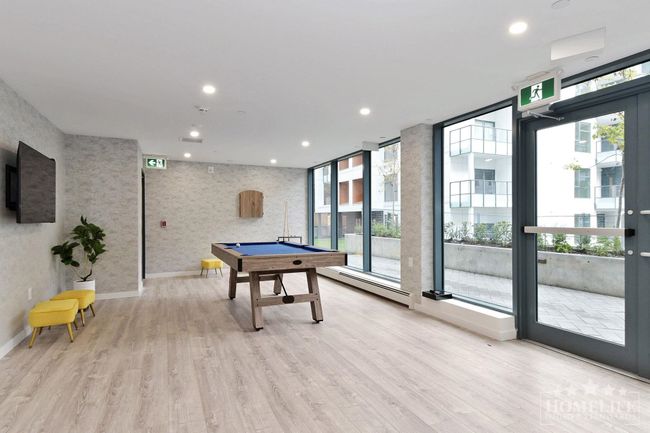 Rec room with recessed lighting, light wood finished floors, billiards, baseboards, and baseboard heating | Image 24