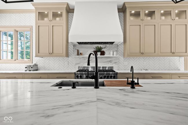 kitchen with custom range hood | Image 16
