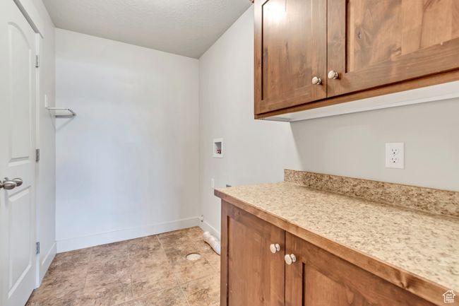 Washroom with cabinet space and washer hookup | Image 14