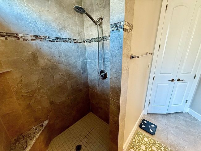 Full bath with tiled shower and baseboards | Image 12