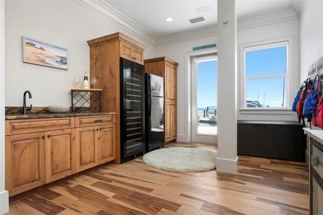 Bonus area with wine fridge, sink and laundry room | Image 68