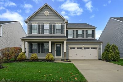 Front of property featuring a garage and a front lawn | Image 1