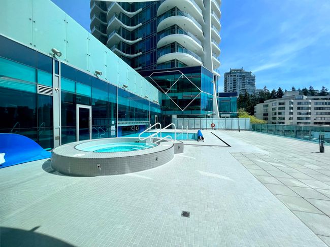 View of pool featuring a community hot tub and a view of city | Image 20
