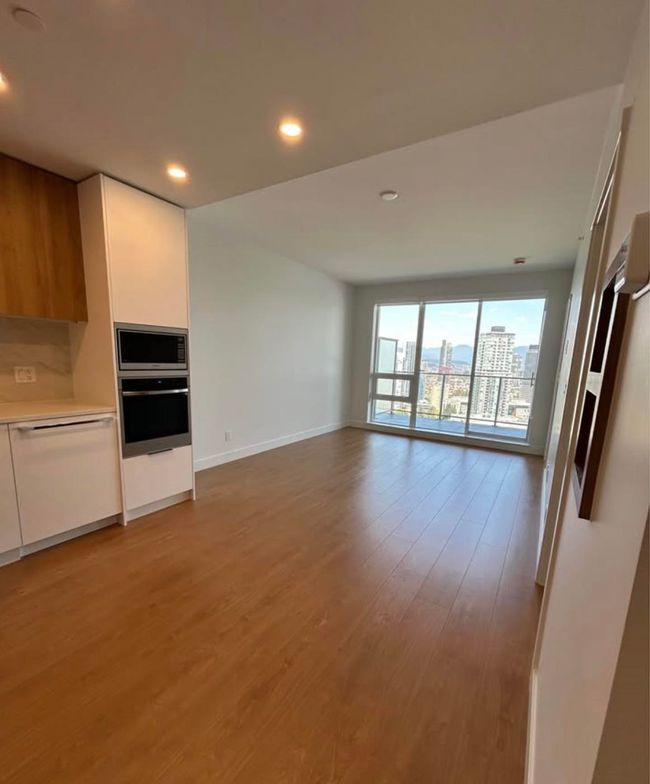 Unfurnished living room featuring recessed lighting, light wood-style flooring, and baseboards | Image 4