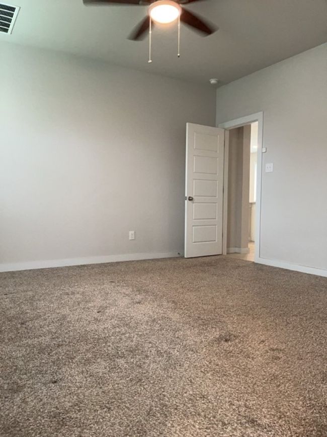 Bedroom featuring carpet floors and a ceiling fan | Image 17