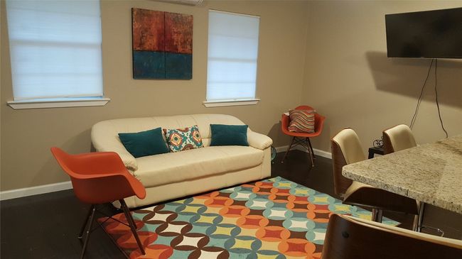 Living room with baseboards and wood finished floors | Image 26