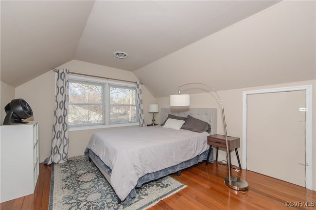 Bedroom with wood-type flooring and vaulted ceiling | Image 27