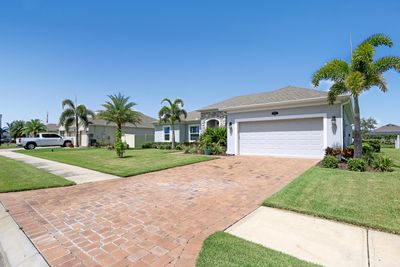 Pavers in the driveway and walk way to the front door. | Image 3