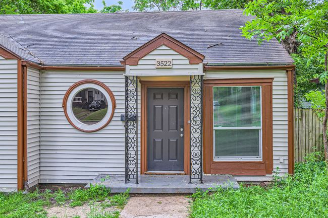 View of exterior entry with a shingled roof | Image 4