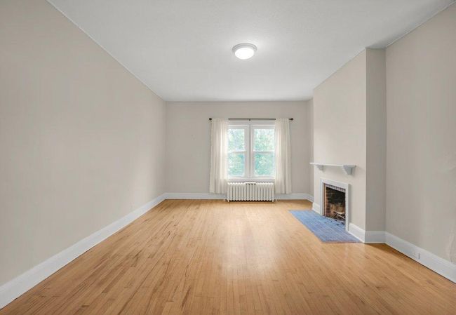 Upper level Family Room with wood burning fireplace | Image 15