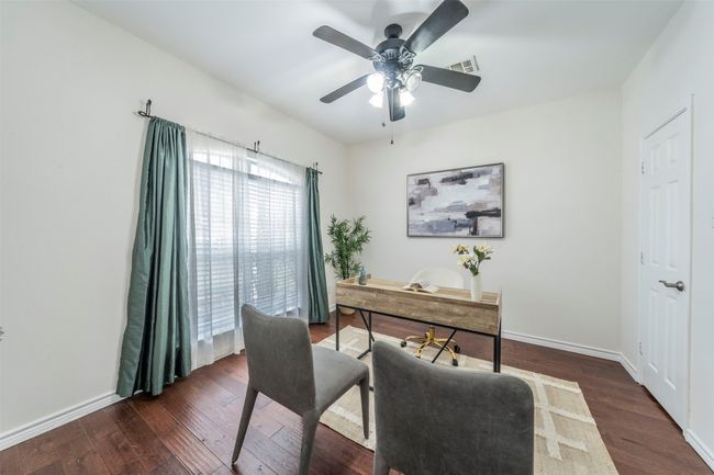 Office area featuring dark wood finished floors and ceiling fan | Image 4