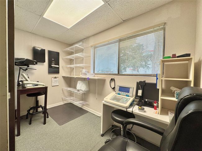 Home office with a paneled ceiling and carpet flooring | Image 36