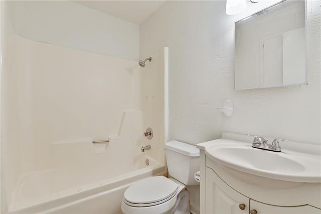 Full bath with toilet, vanity, and shower / bath combination | Image 10