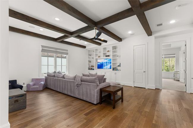 Built in entertainment center with cabinets & shelves; Audio Visual closet; | Image 29