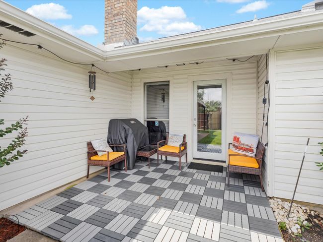 Patio with seating area and outdoor grill | Image 23