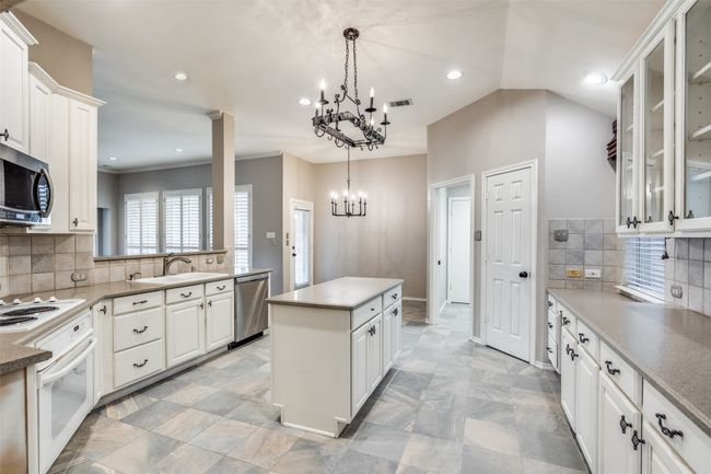 Updated neutral flooring in kitchen and breakfast room. | Image 10