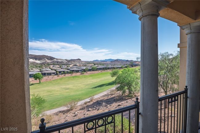Mountain view featuring a golf club and nearby suburban area | Image 22